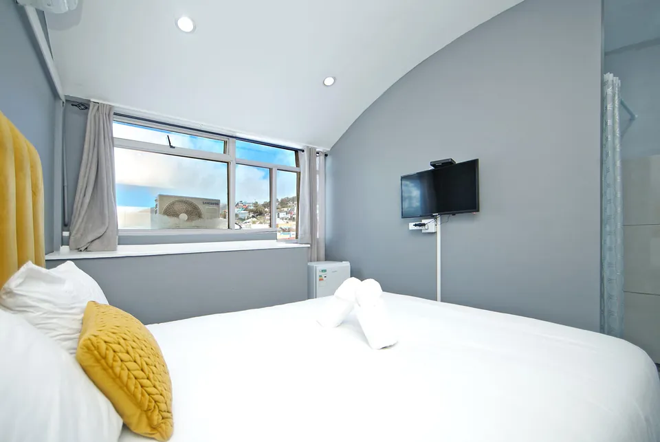 Bedroom window with a view out over Cape Town